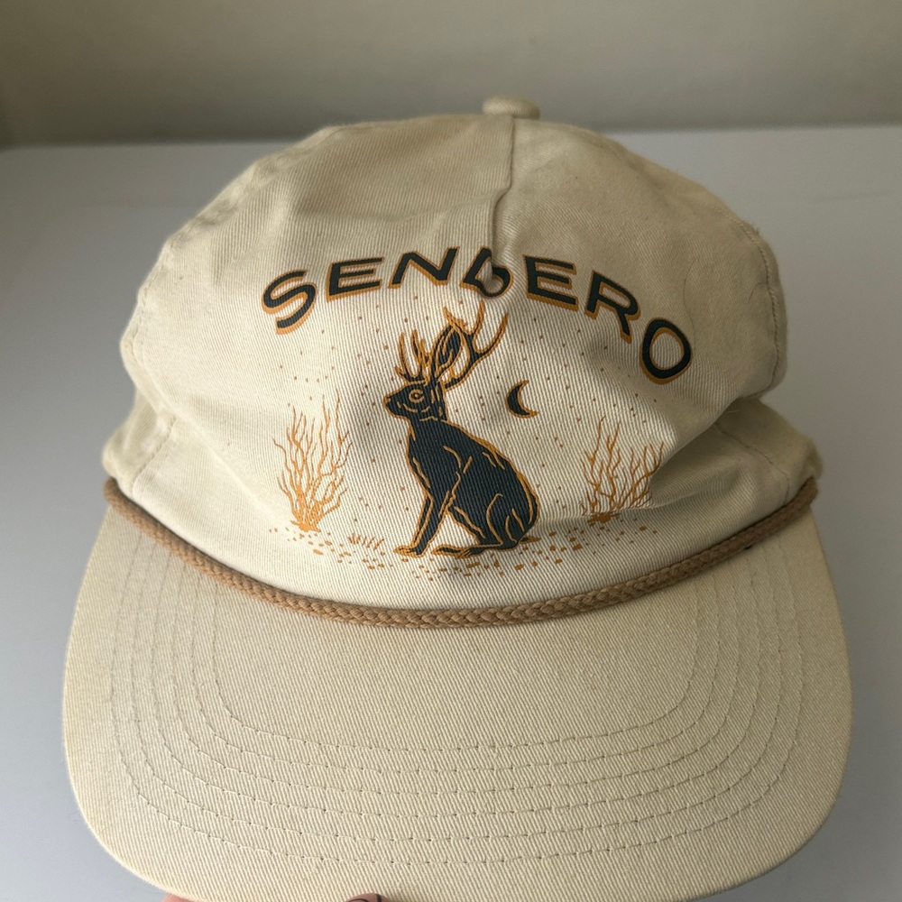 Sendero Cream Cap with Black and Gold Design